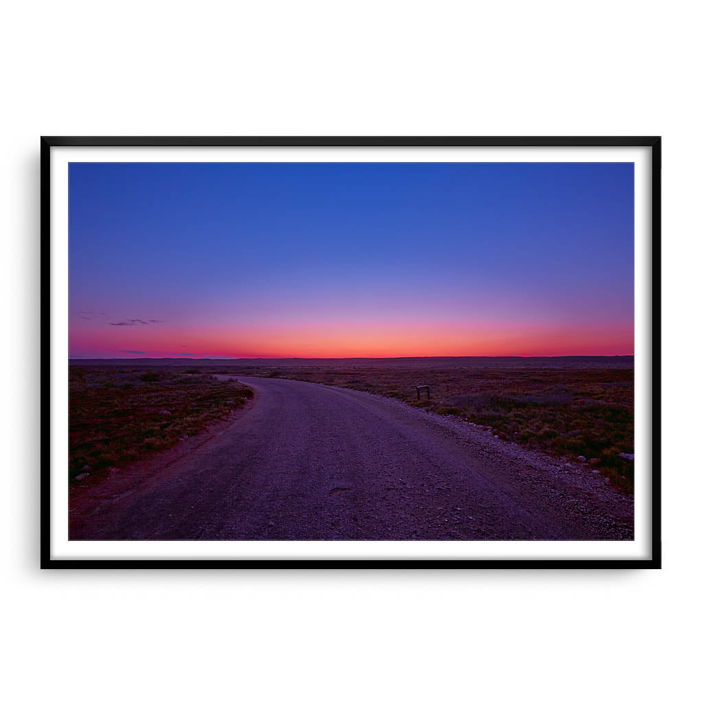 Sunrise over the Cape Range in Western Australia framed in black