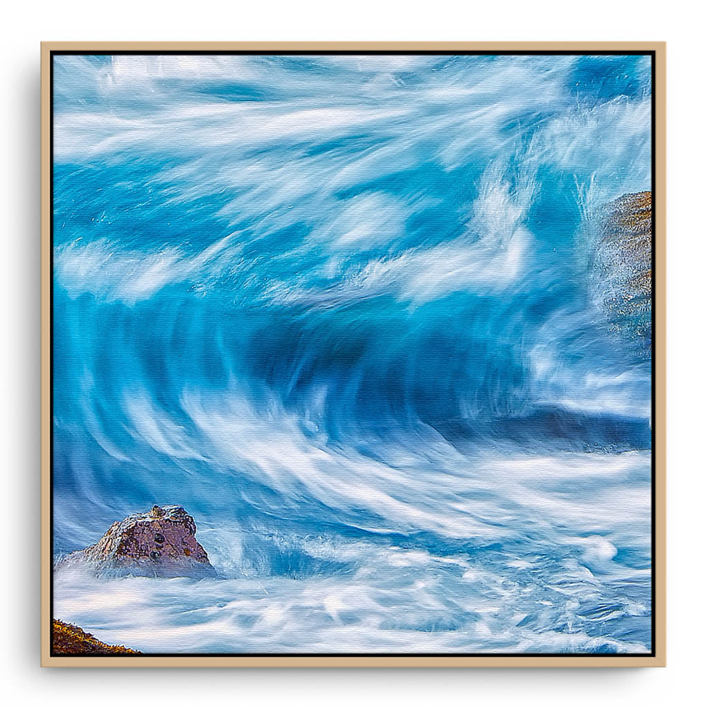 Blue wave in slow motion framed canvas in raw oak