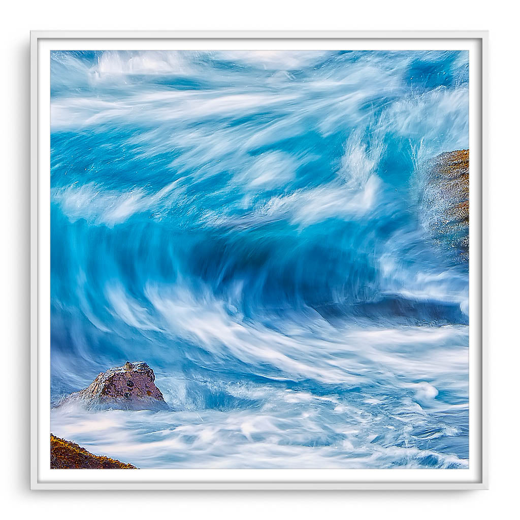 Blue wave in slow motion framed in white