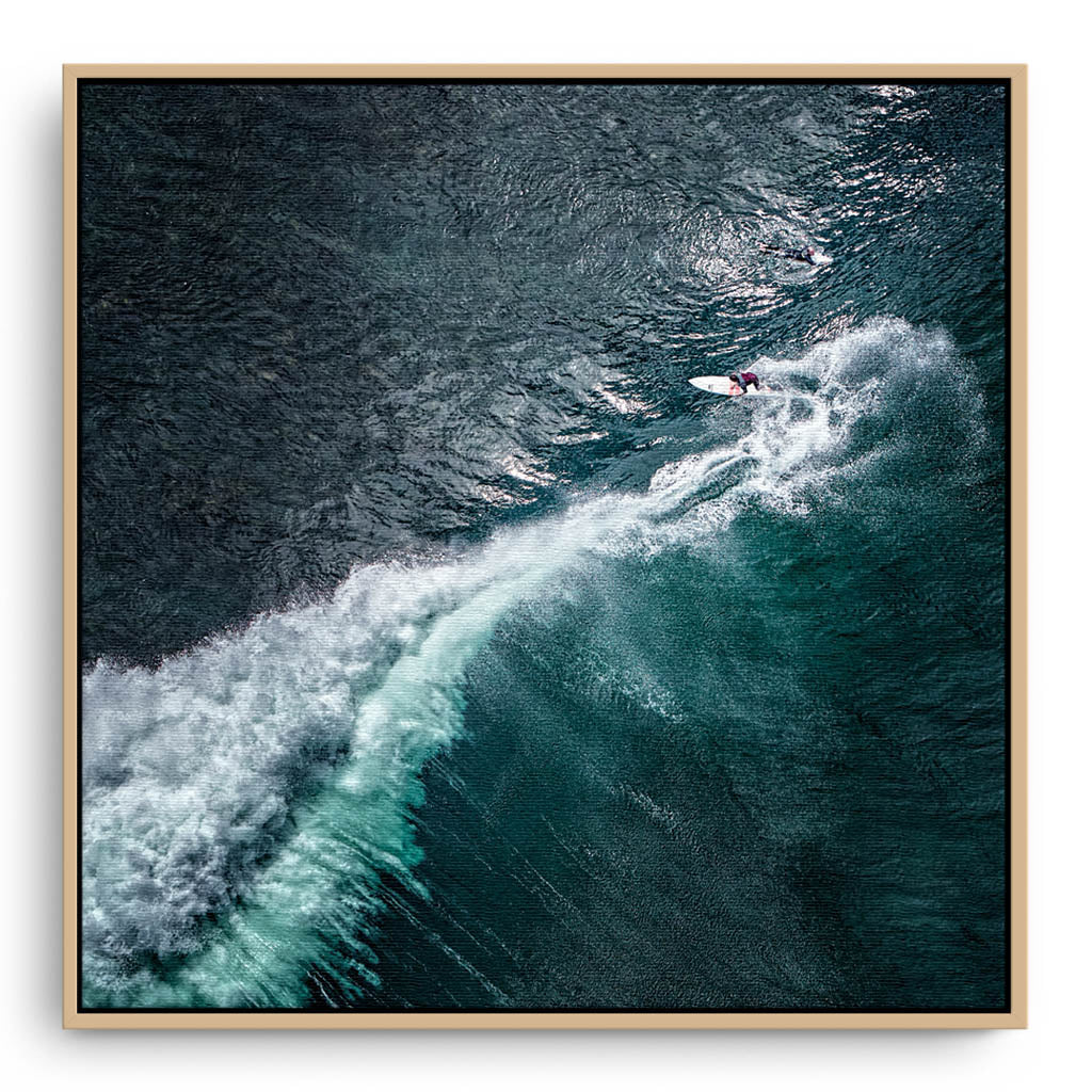 Aerial view of surfer at Margaret River Main Break in Western Australia framed canvas in raw oak