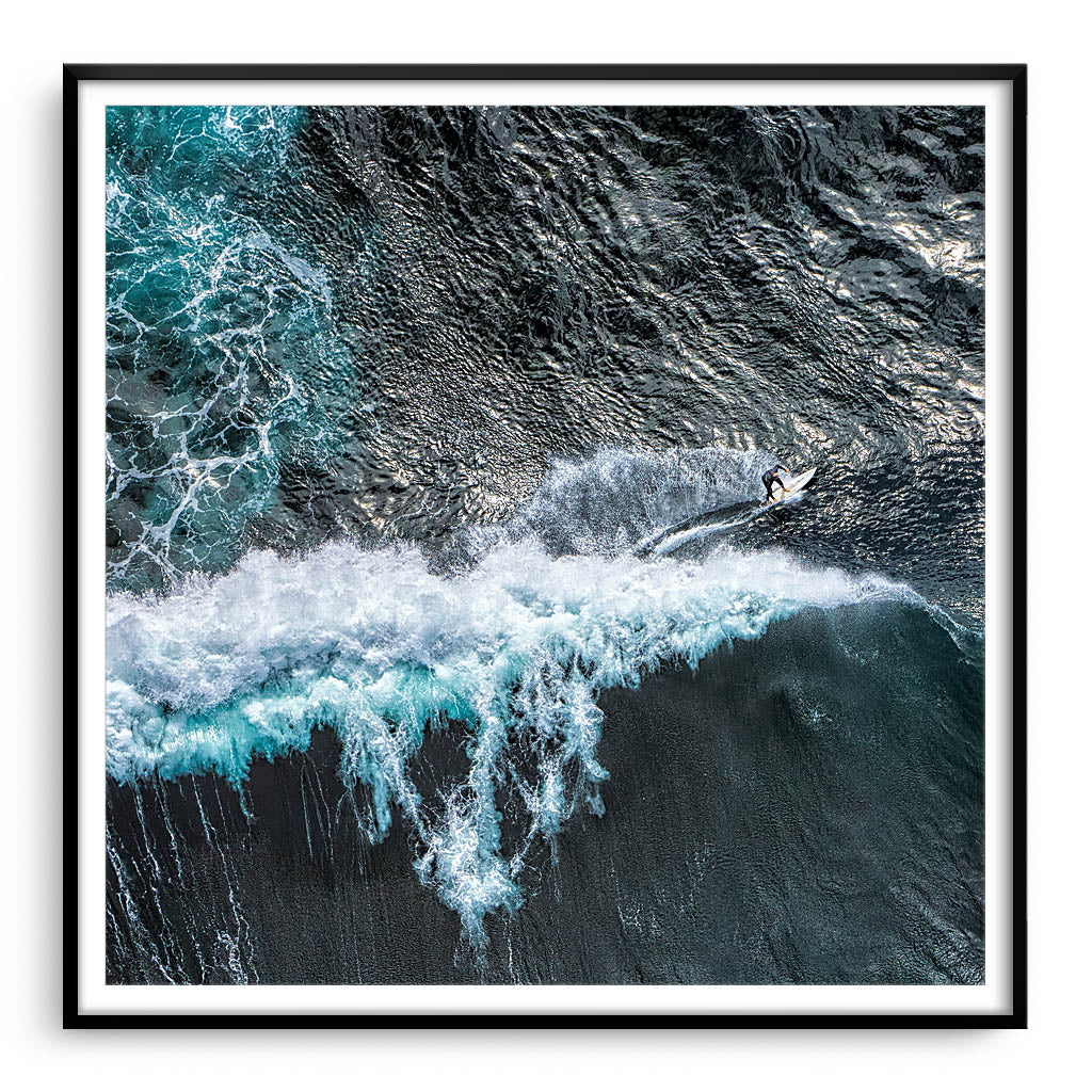 Aerial view of surfer at Margaret River Main Break in Western Australia framed in black