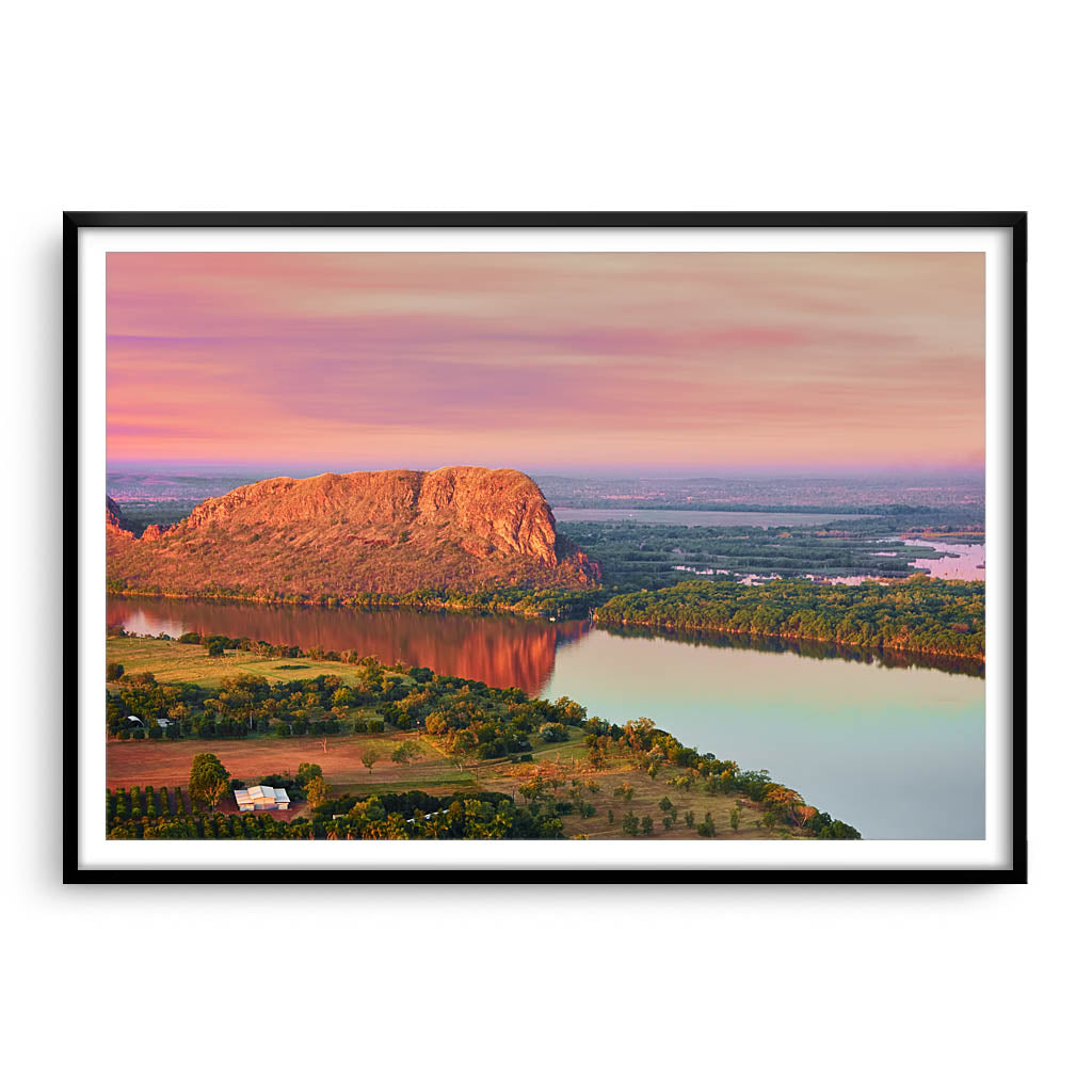 Elephant rock at sunset on Lake Kununurra in Western Australia framed in black
