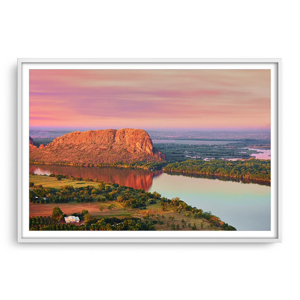 Elephant rock at sunset on Lake Kununurra in Western Australia framed in white