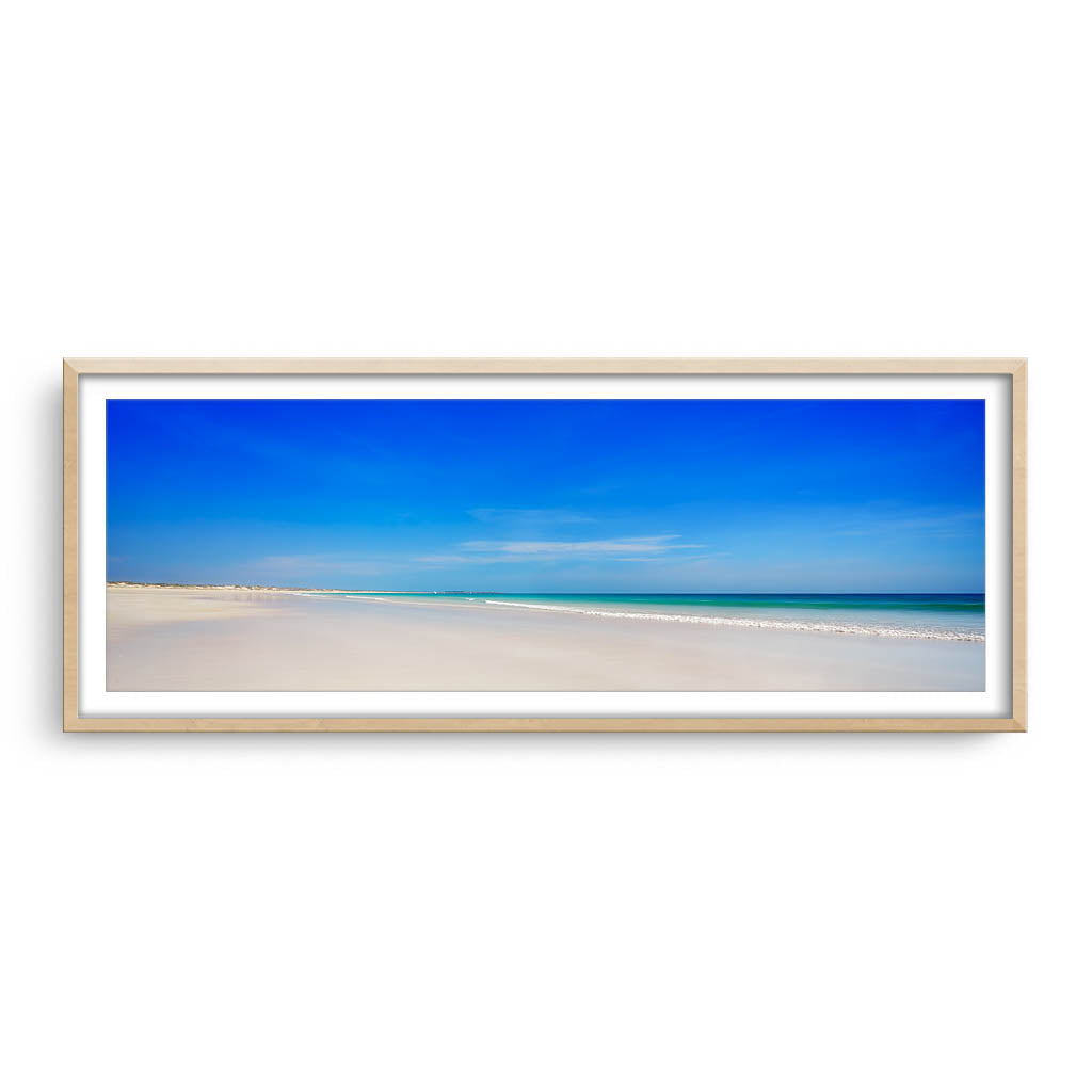 Blue skies at Cable Beach in Broome, Western Australia framed in raw oak