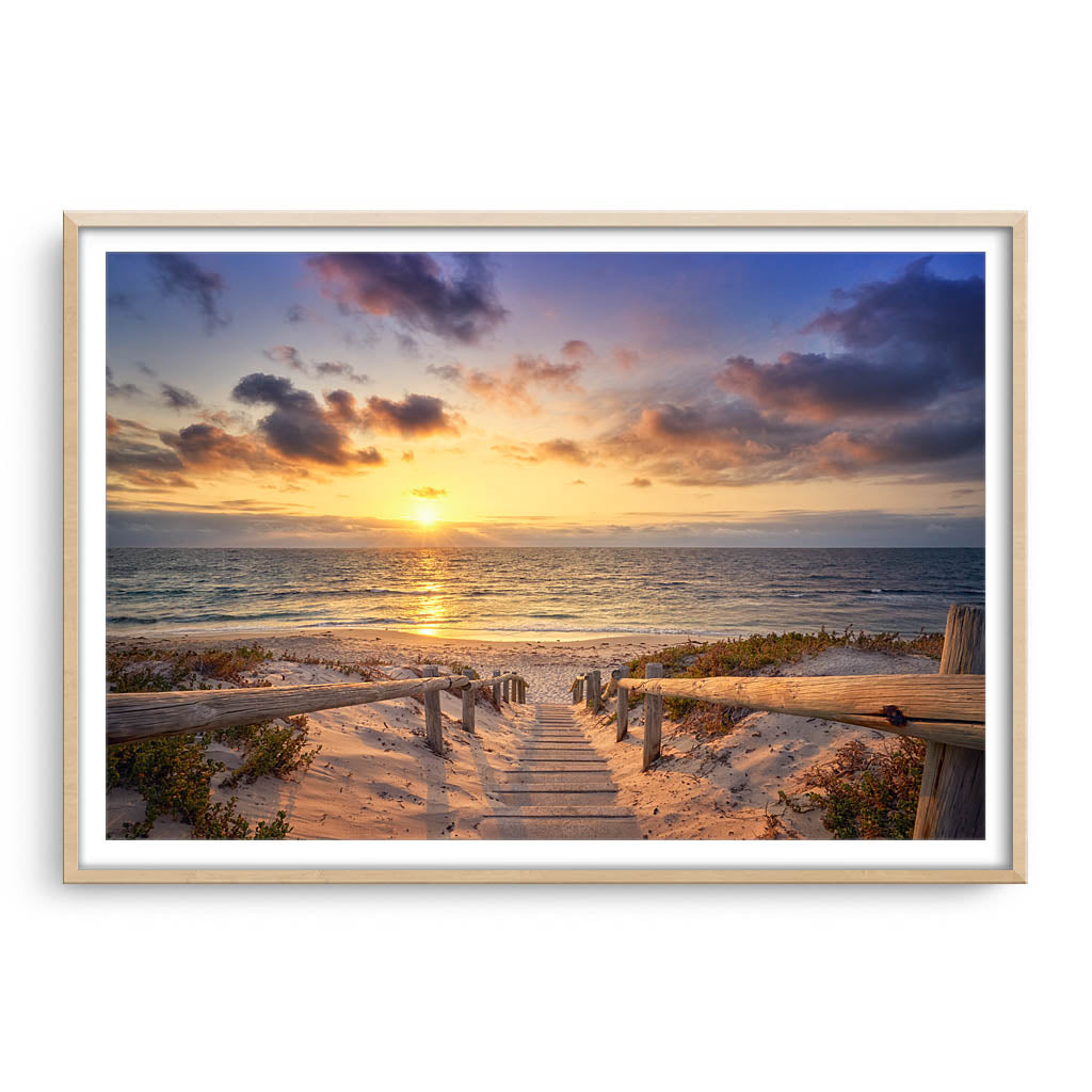 Beautiful golden sunset at North Beach in Perth, Western Australia framed in raw oak
