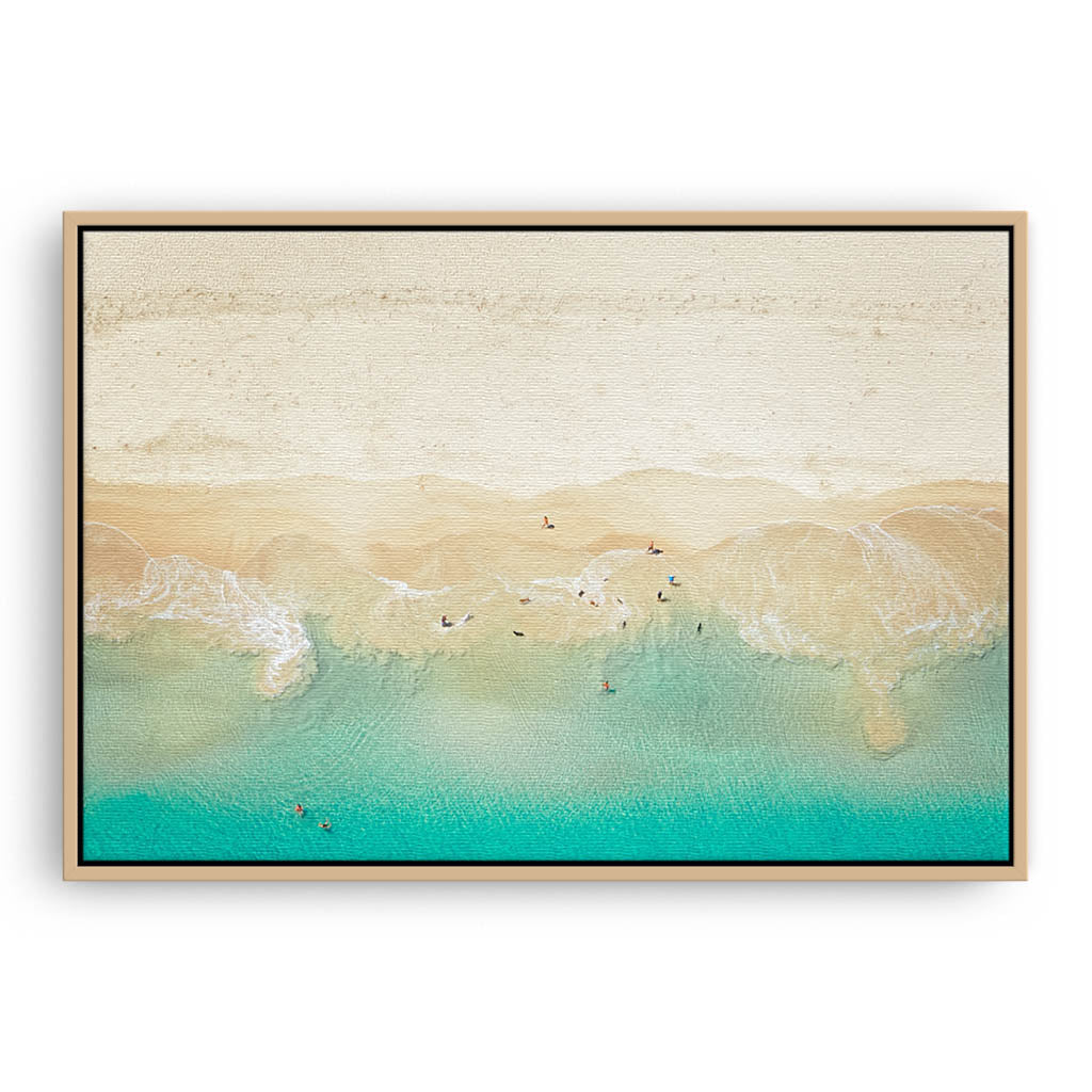 Aerial view of dogs playing in the ocean, Perth, Western Australia framed canvas in raw oak