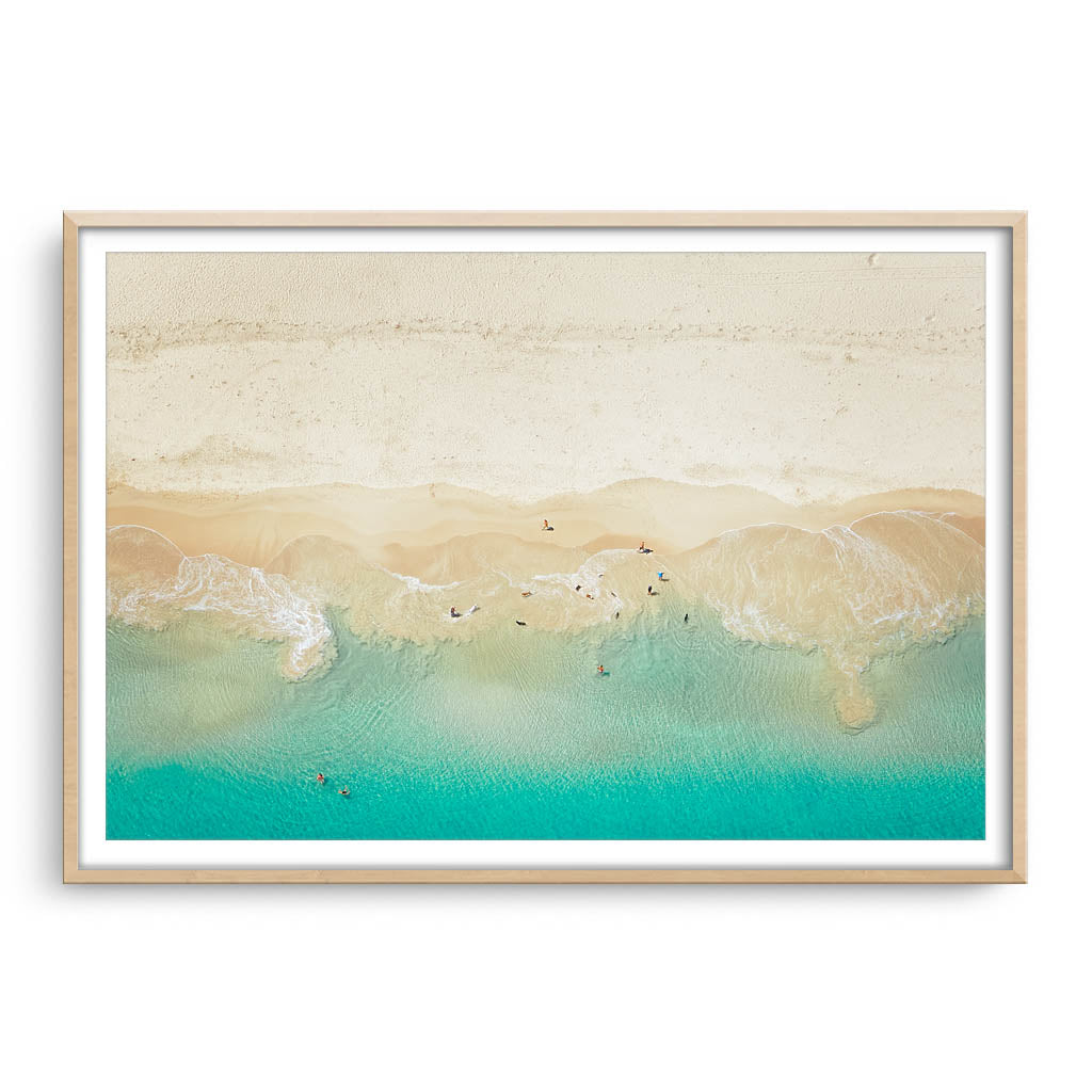 Aerial view of dogs playing in the ocean, Perth, Western Australia framed in raw oak