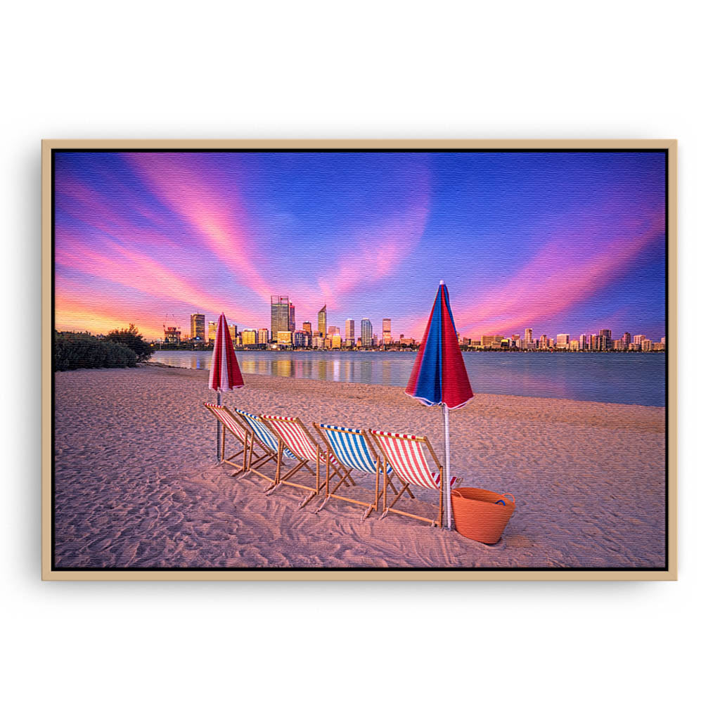 Deckchairs on the beach, overlooking Perth City at sunset in Western Australia framed canvas in raw oak