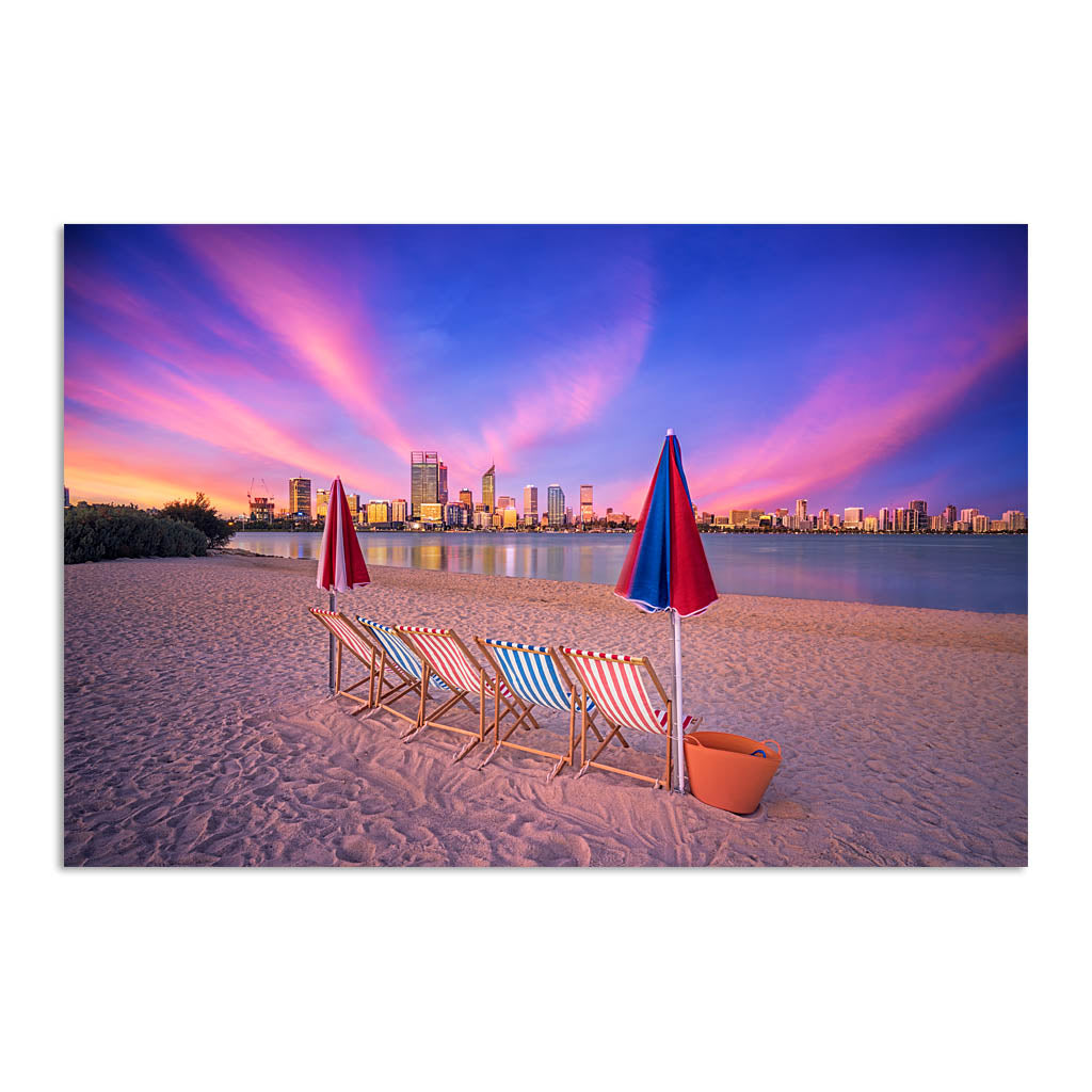 Deckchairs on the beach, overlooking Perth City at sunset in Western Australia