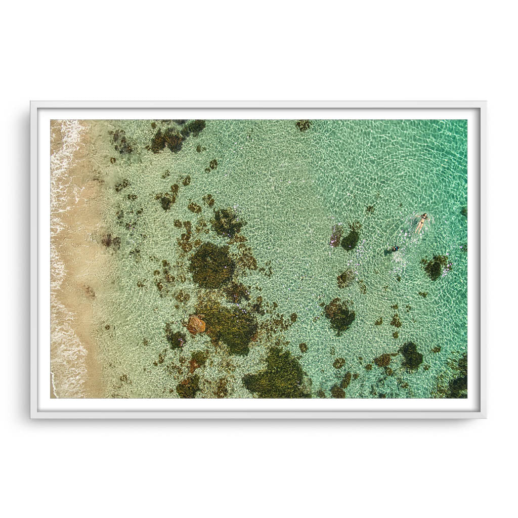 swimming at castle rock in south west australia framed in white