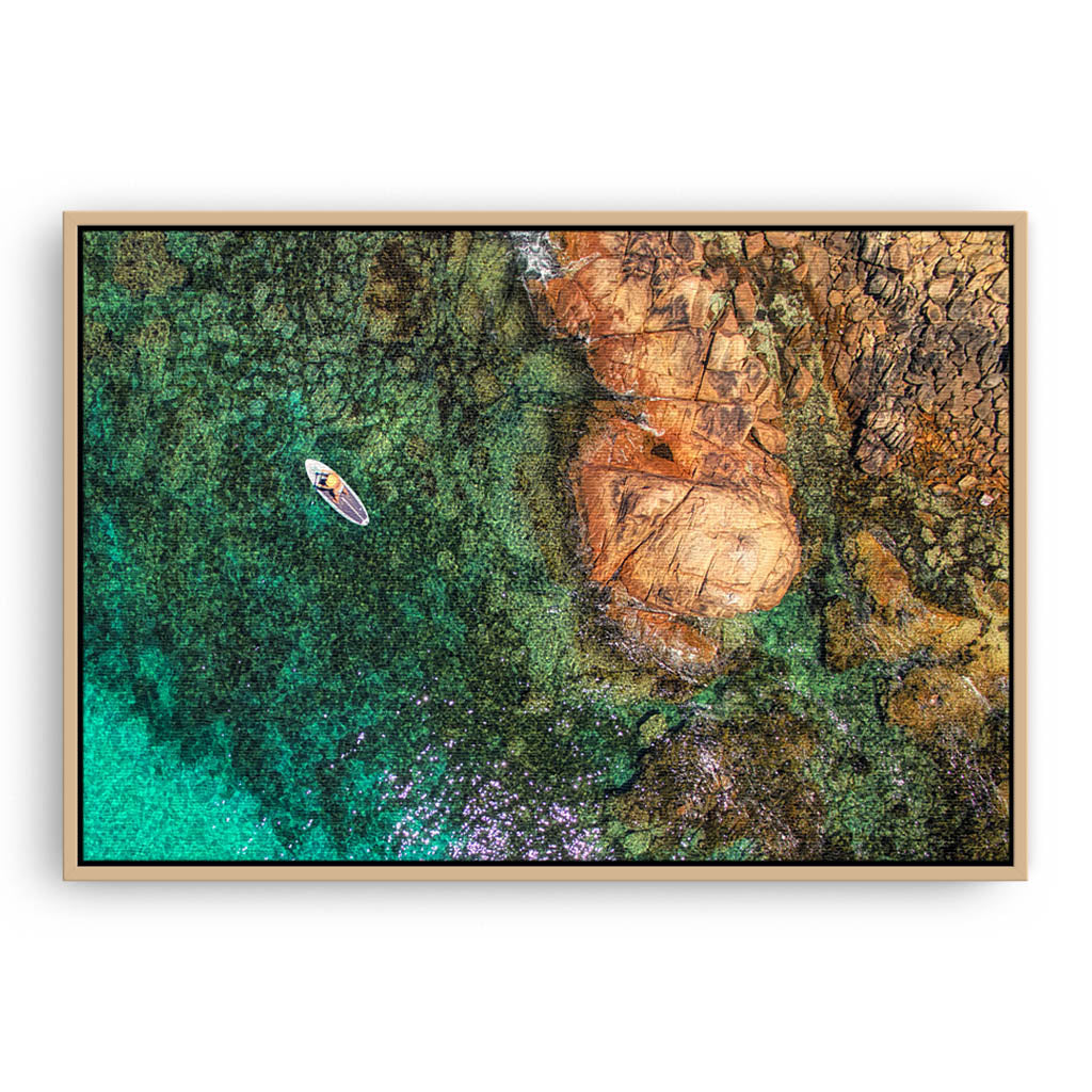 Aerial view of SUP at Meelup Beach in Western Australia framed canvas in raw oak