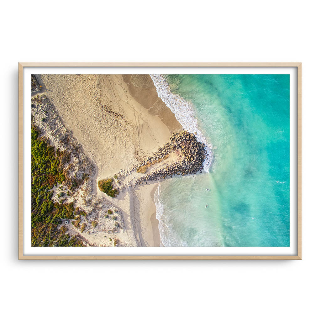 Aerial view of surfers at Sorrento Beach in Western Australia framed in raw oak