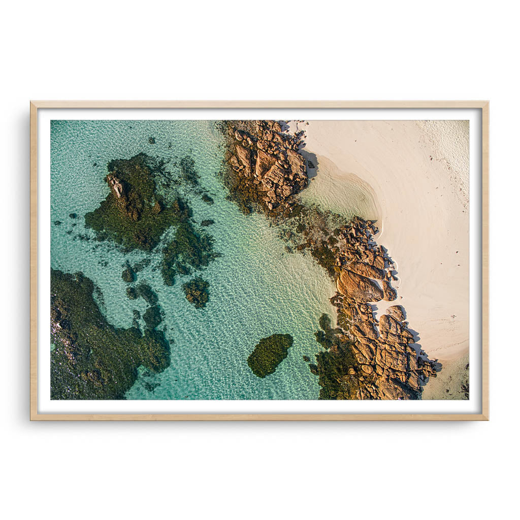 Rockpools at Flinders Bay in Augusta, Western Australia framed in raw oak