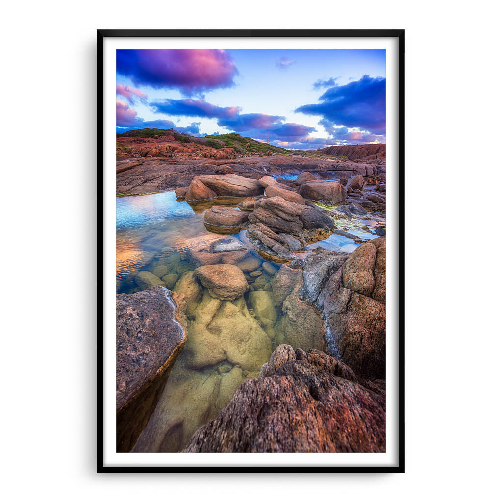 Colourful rock pools at Cape Leeuwin in Western Australia framed in black