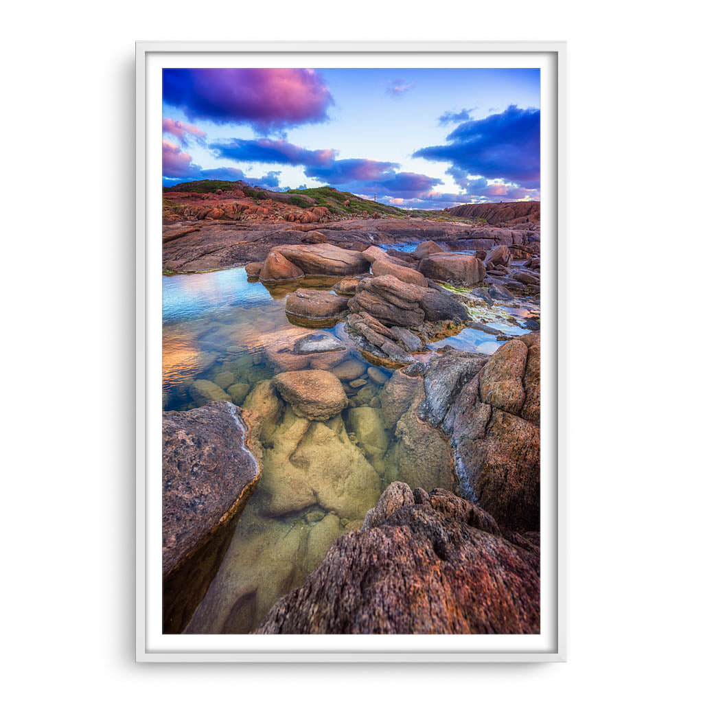 Colourful rock pools at Cape Leeuwin in Western Australia framed in white