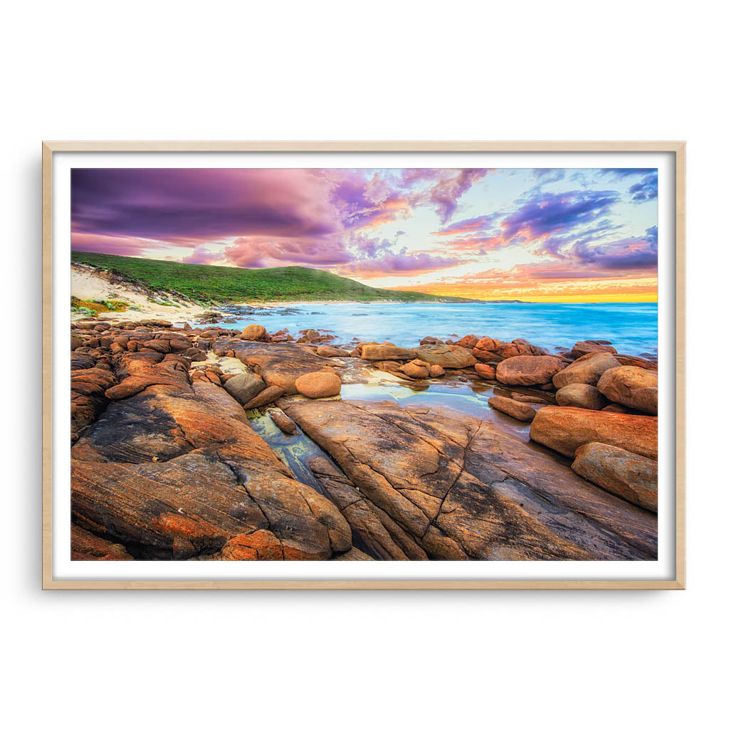 Sunrise over the beaches of Augusta in Western Australia framed in raw oak