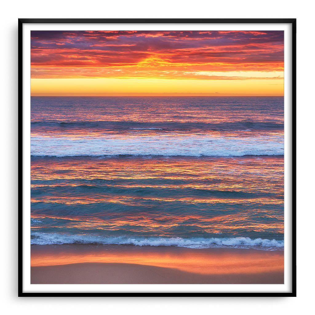 Multi-layered sunset at Mettams Pool in Perth, Western Australia framed in black