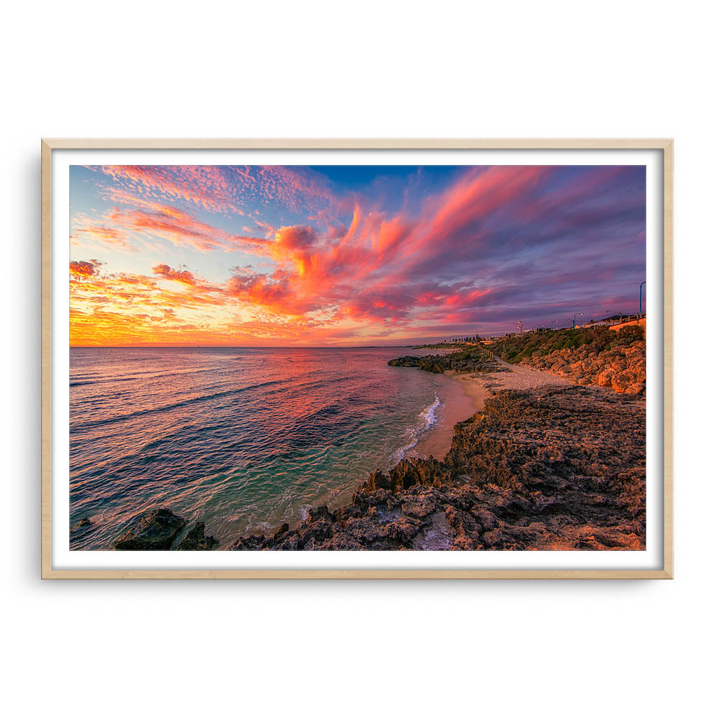 Candy Floss clouds at Mettams Pool in Perth, Western Australia framed in raw oak