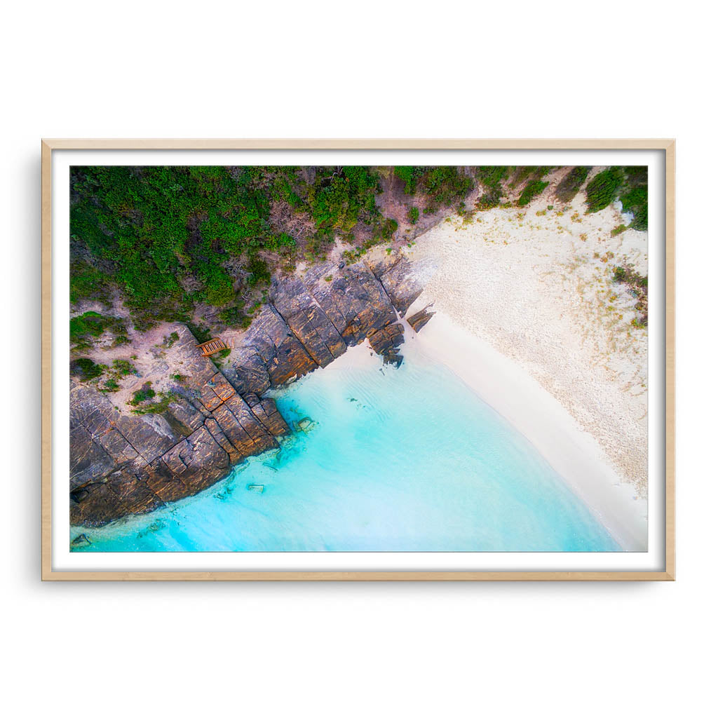 Aerial view of 11 Mile Beach in Esperance, Western Australia framed in raw oak