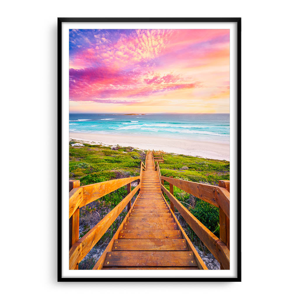 Wooden steps leading down to the beach at sunset in Esperance, Western Australia framed in black