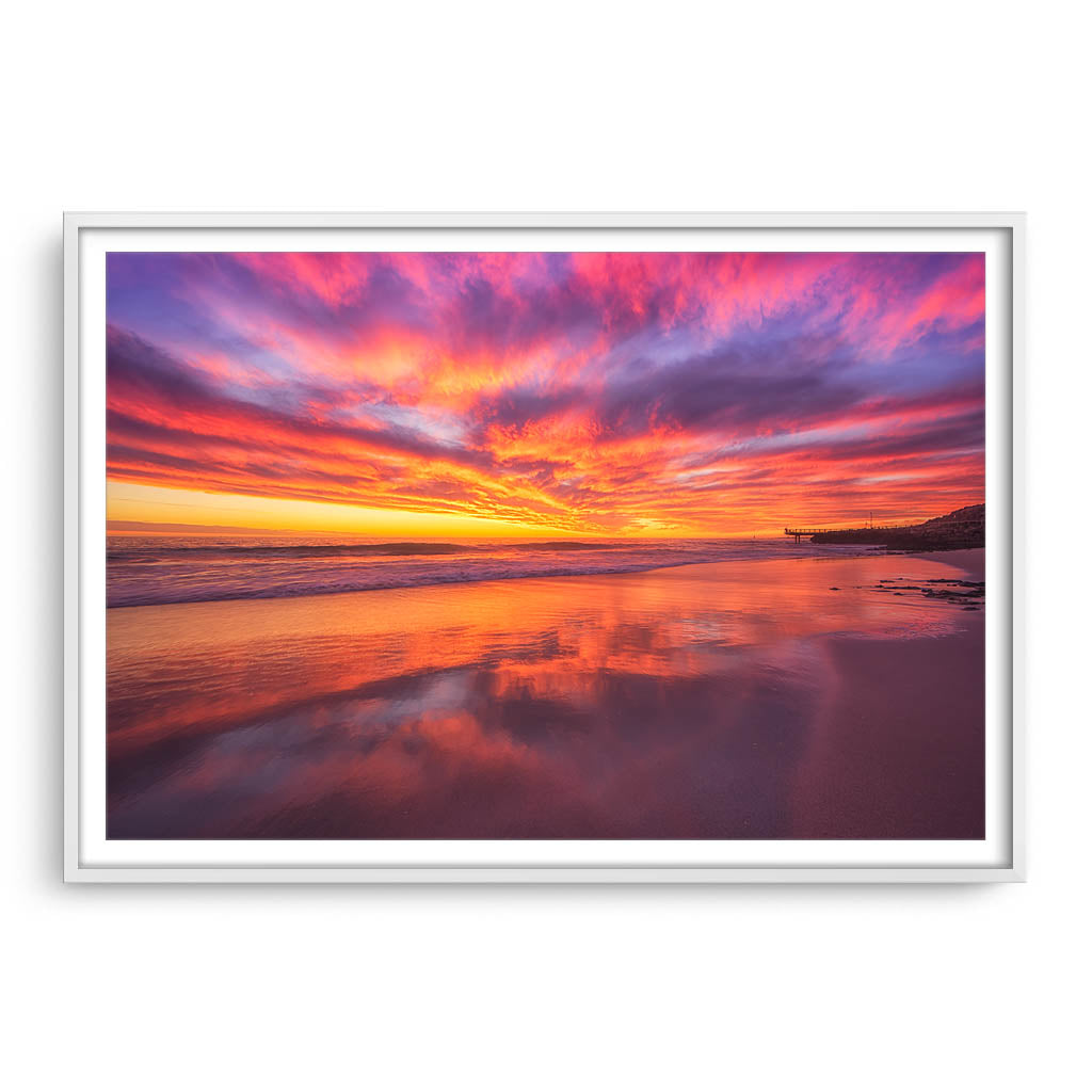 Rich, colourful sunset at North Beach in Western Australia framed in white