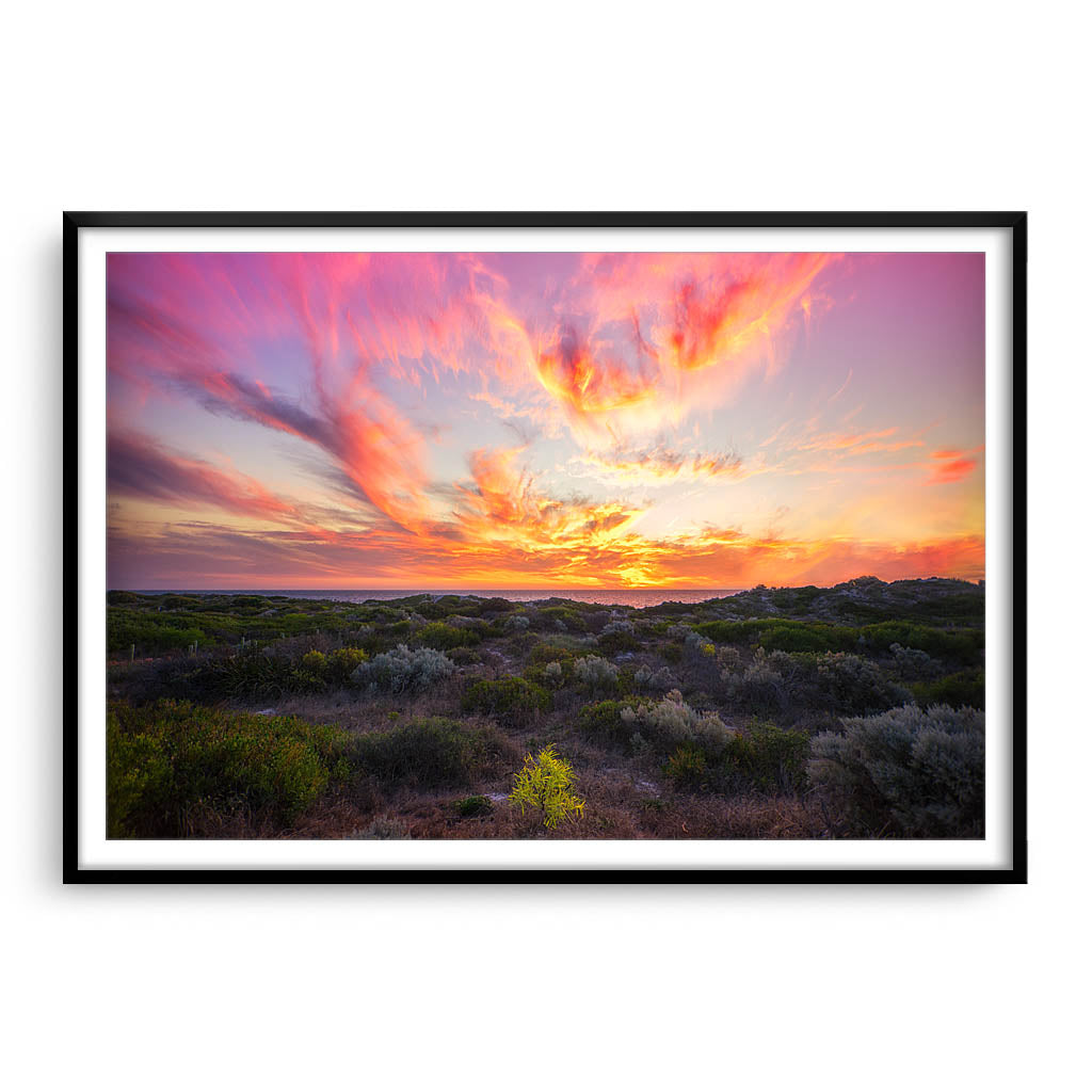 Warm, magenta sunset at Mullaloo Beach in Perth, Western Australia framed in black