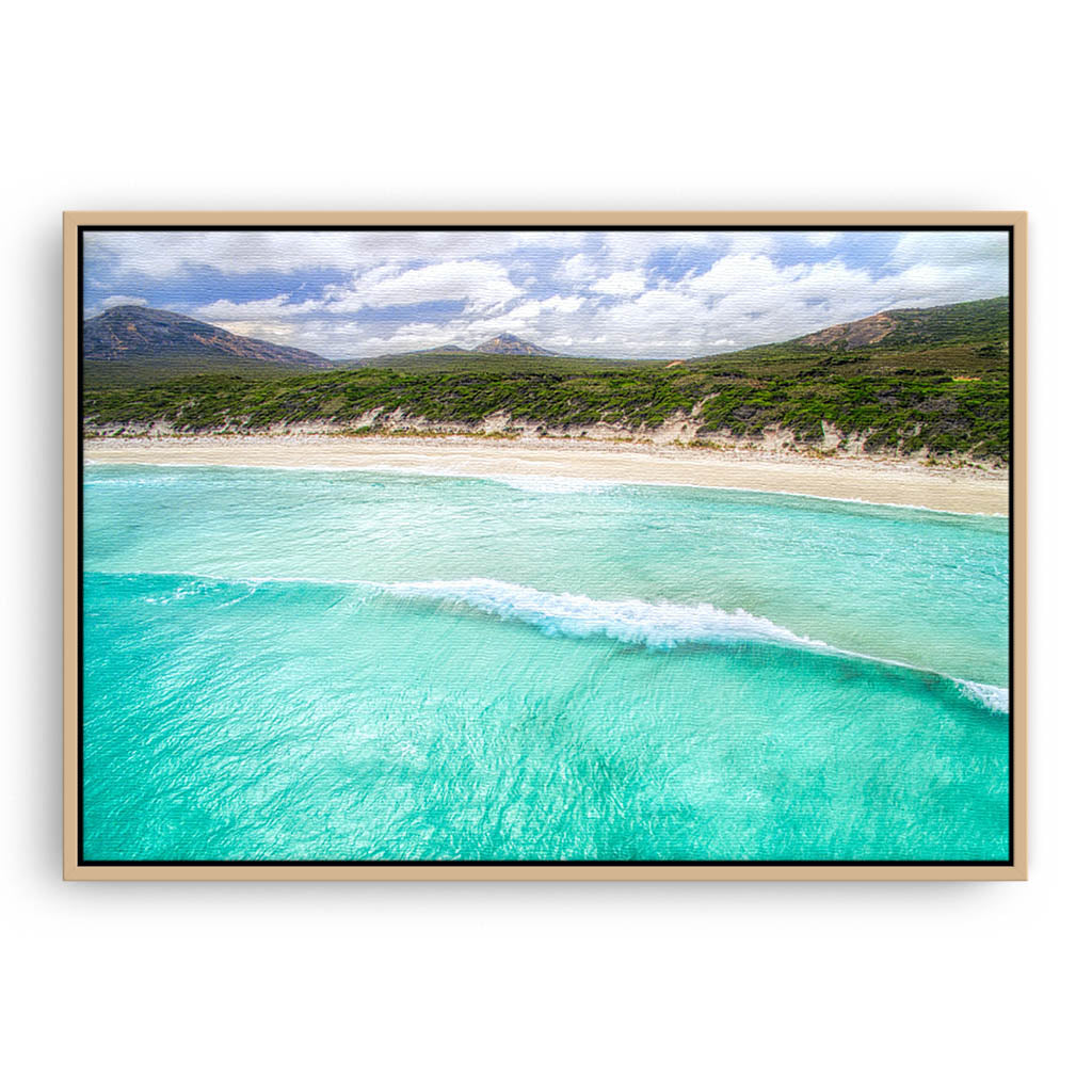 Aerial view of wave rolling into the beach at Hellfire Bay, Western Australia framed canvas in raw oak
