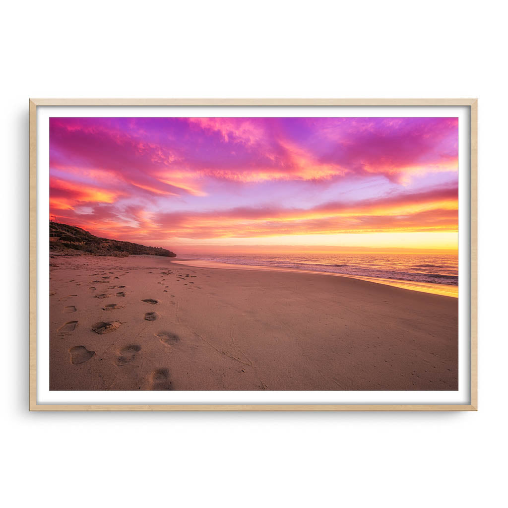 Sunset footprints at North Beach, Perth, Western Australia framed in raw oak