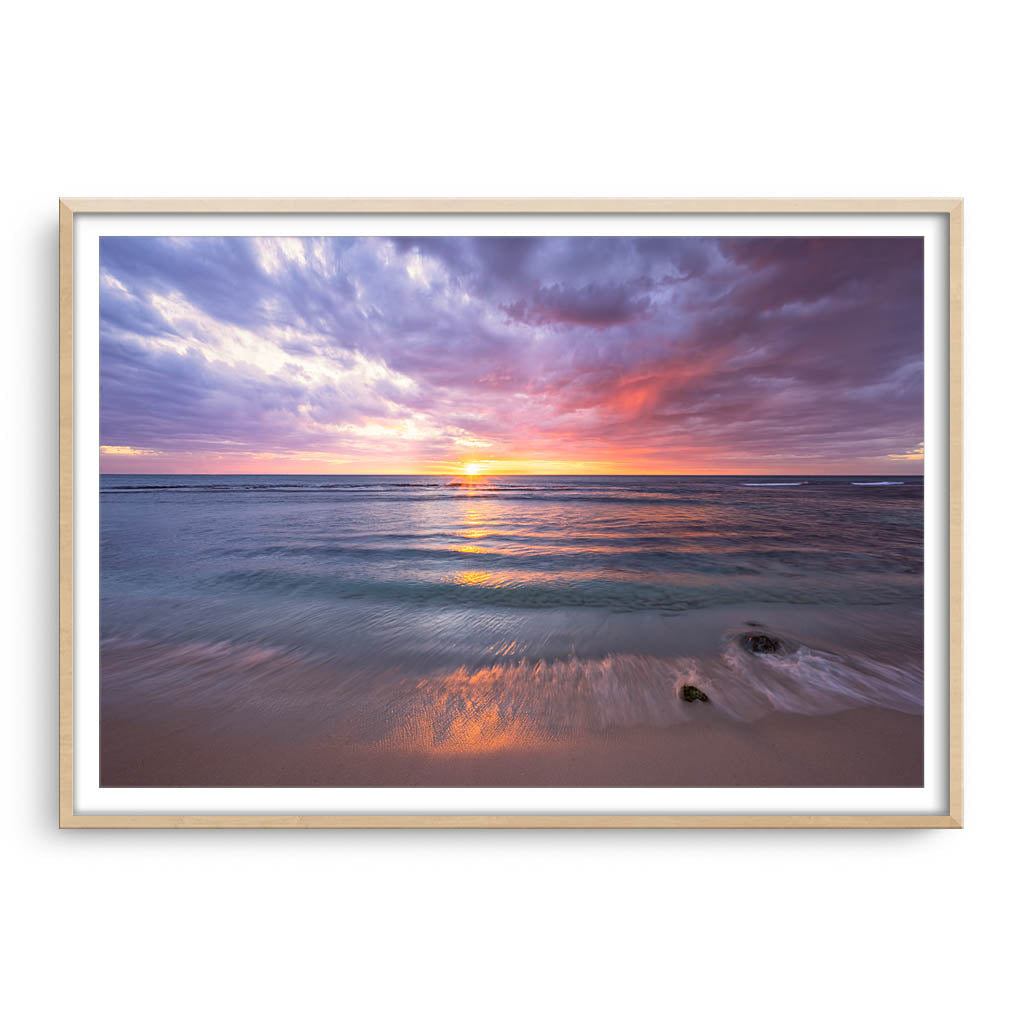 Magical sunset at Mettams pool in Perth, Western Australia framed in raw oak