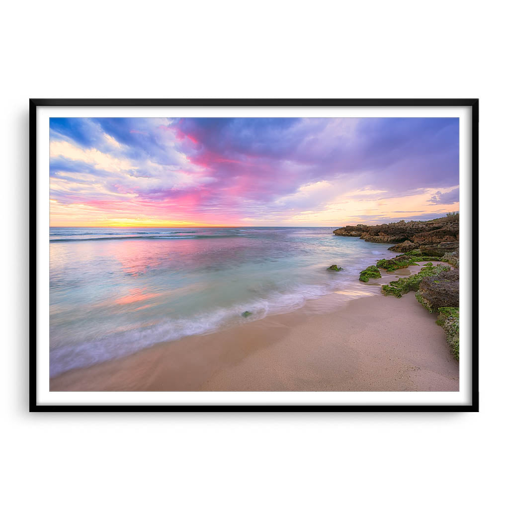 Pastel coloured sunset at Mettams Pool in Perth, Western Australia framed in black