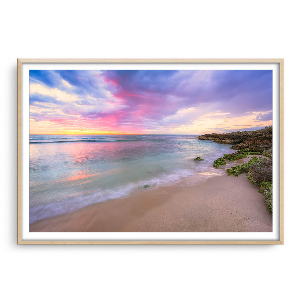 Pastel coloured sunset at Mettams Pool in Perth, Western Australia framed in raw oak