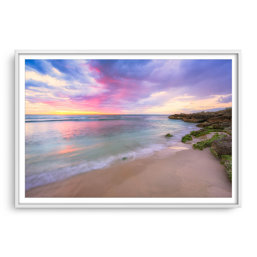 Pastel coloured sunset at Mettams Pool in Perth, Western Australia framed in white