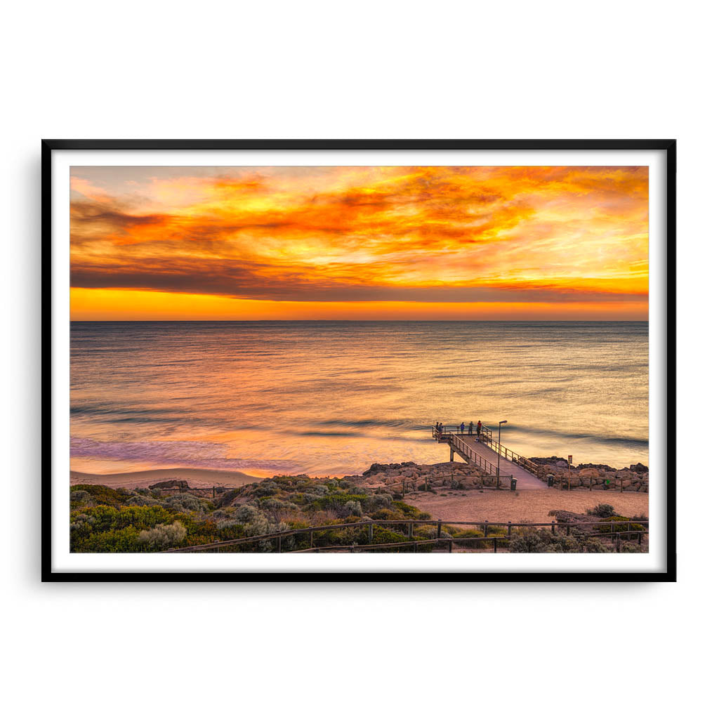 Smoke filled sunset over North Beach Jetty in Perth, Western Australia framed in black