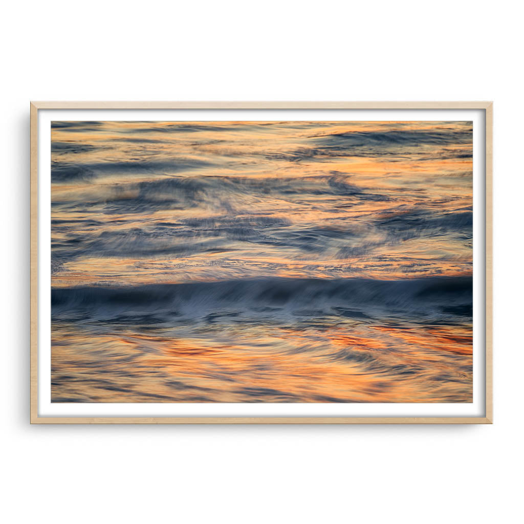 Abstract ocean waves in Western Australia framed in raw oak