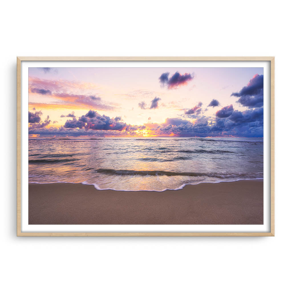 Soft coloured sunset over Mettams Pool in Perth, Western Australia framed in raw oak