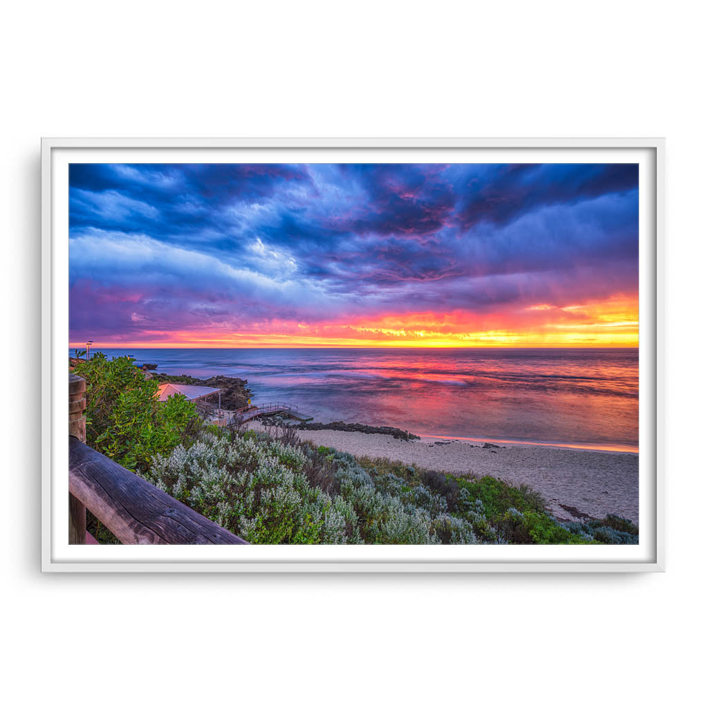 Colourful sunset over Mettams Pool in Perth, Western Australia framed in white