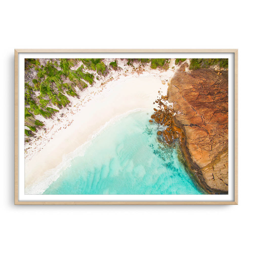 Aerial view of Hellfire Bay in Esperance, Western Australia framed in raw oak