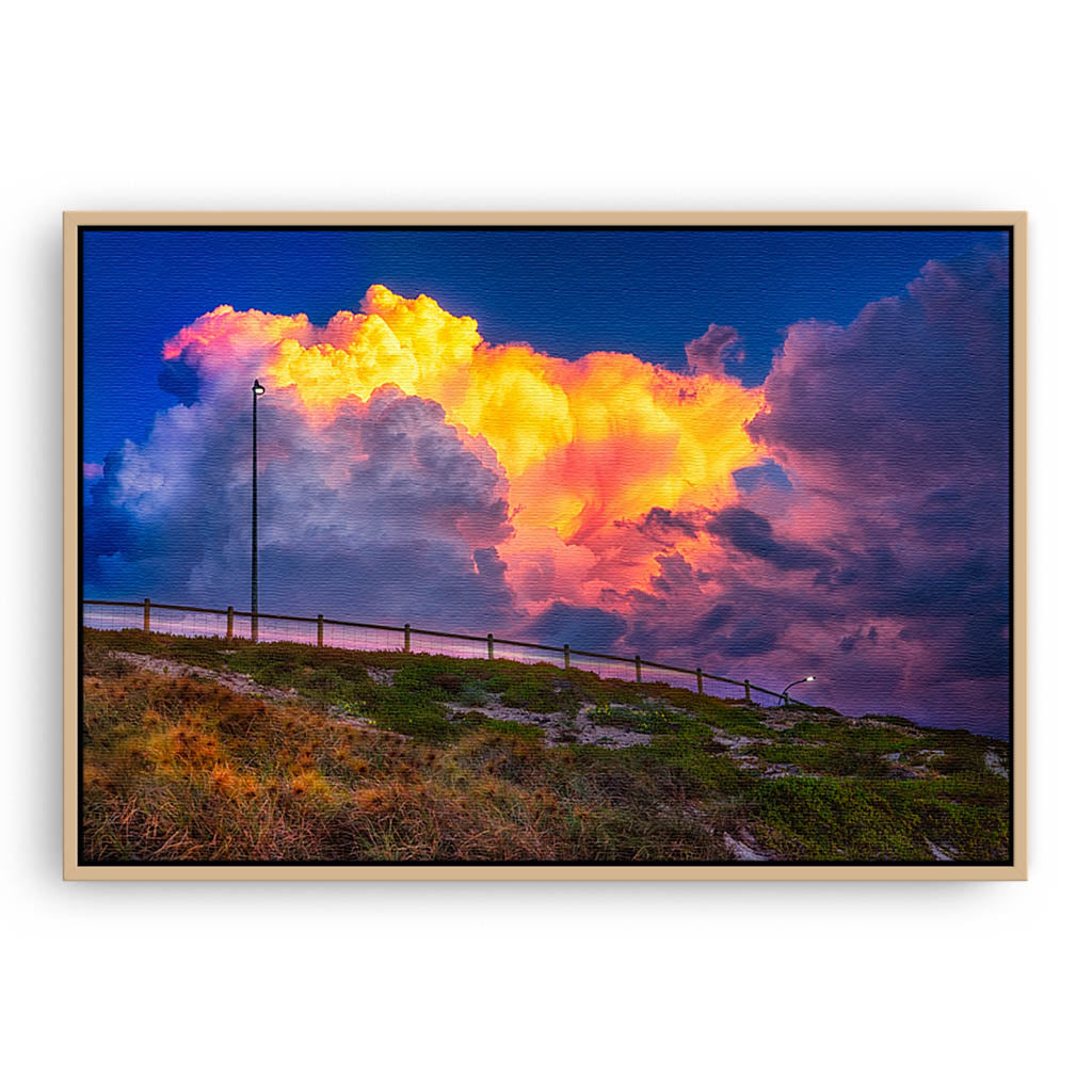 Storm clouds forming over Mettams Pool in Perth, Western Australia framed canvas in raw oak