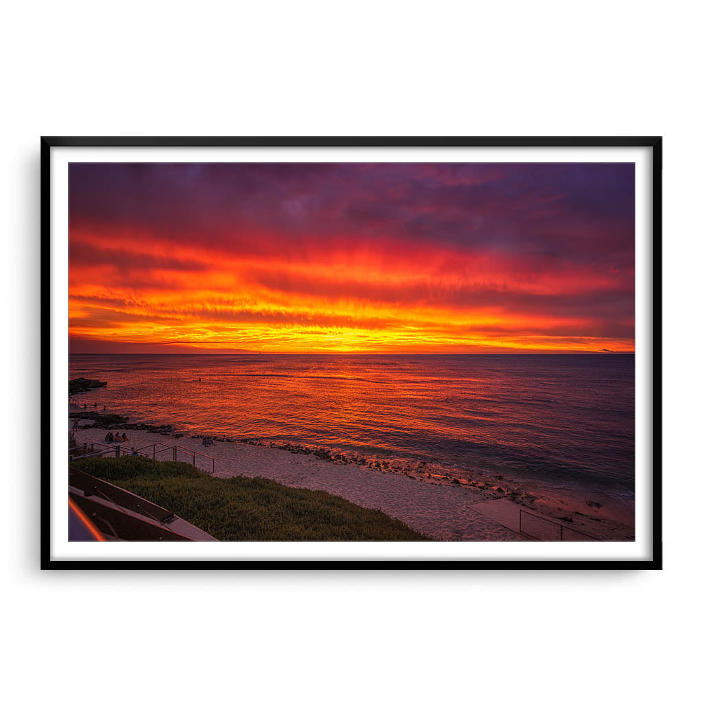 Fiery skies over Mettams Pool in Perth, Western Australia framed in black