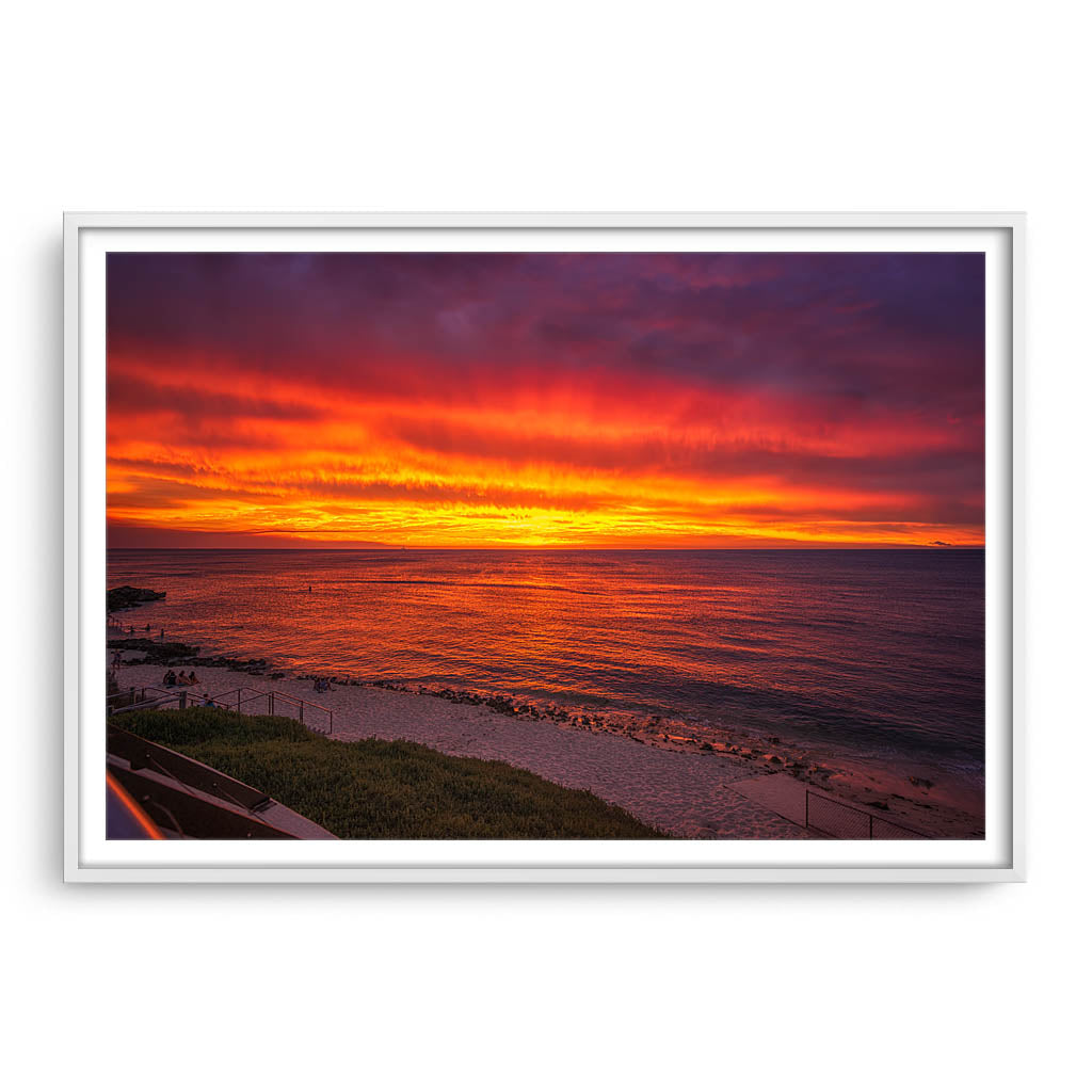 Fiery skies over Mettams Pool in Perth, Western Australia framed in white