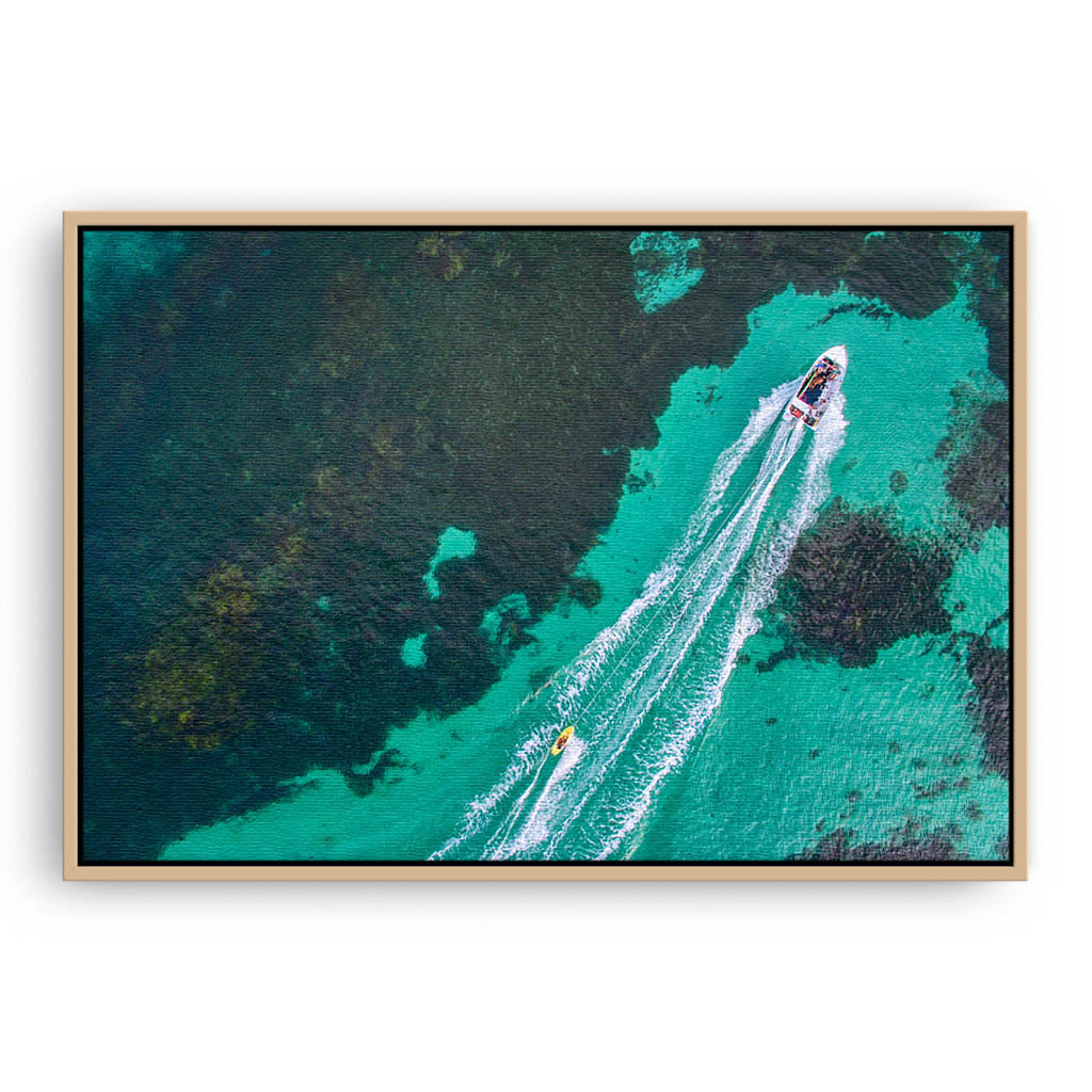 Aerial view of water skier in Augusta, Western Australia framed canvas in raw oak