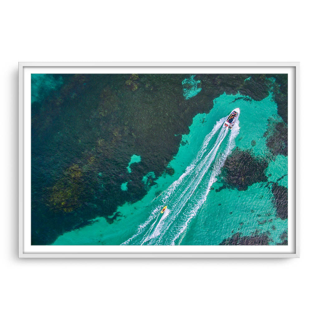 Aerial view of water skier in Augusta, Western Australia framed in white