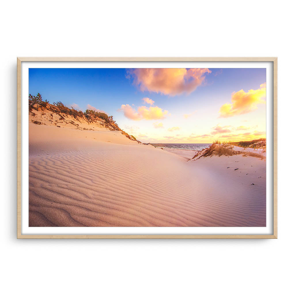 Sand ripples at sunset at Sandy Cape, Western Australia  framed in raw oak