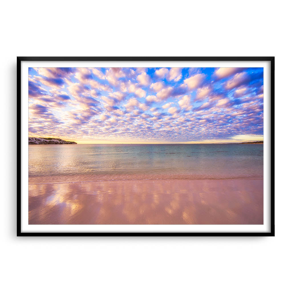 Cotton candy clouds over Sandy Cape in Western Australia framed in black