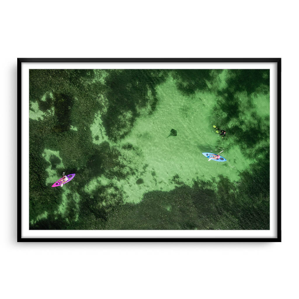 Aerial view of kayaks and stingray at Sandy Cape in Western Australia framed in black