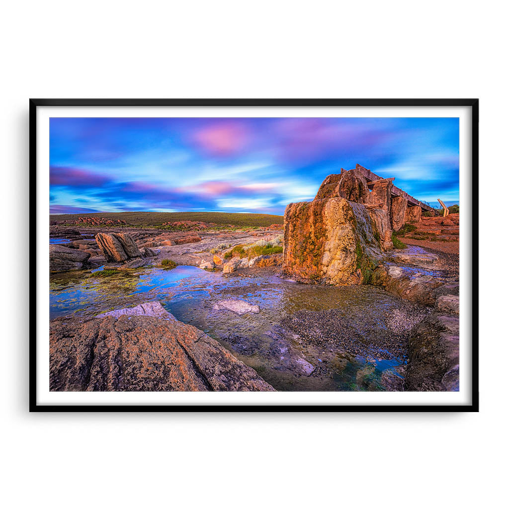 Old water wheel at sunset in Augusta, Western Australia framed in black