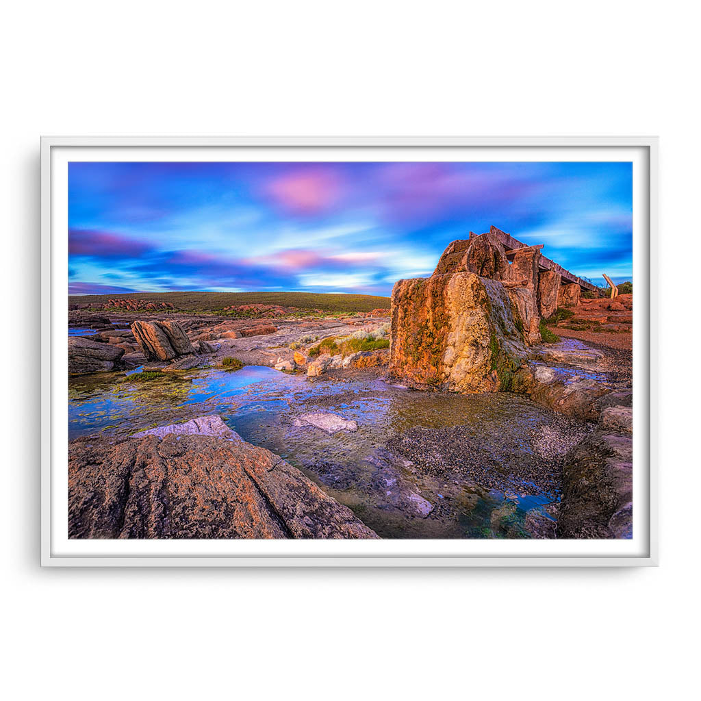 Old water wheel at sunset in Augusta, Western Australia framed in white