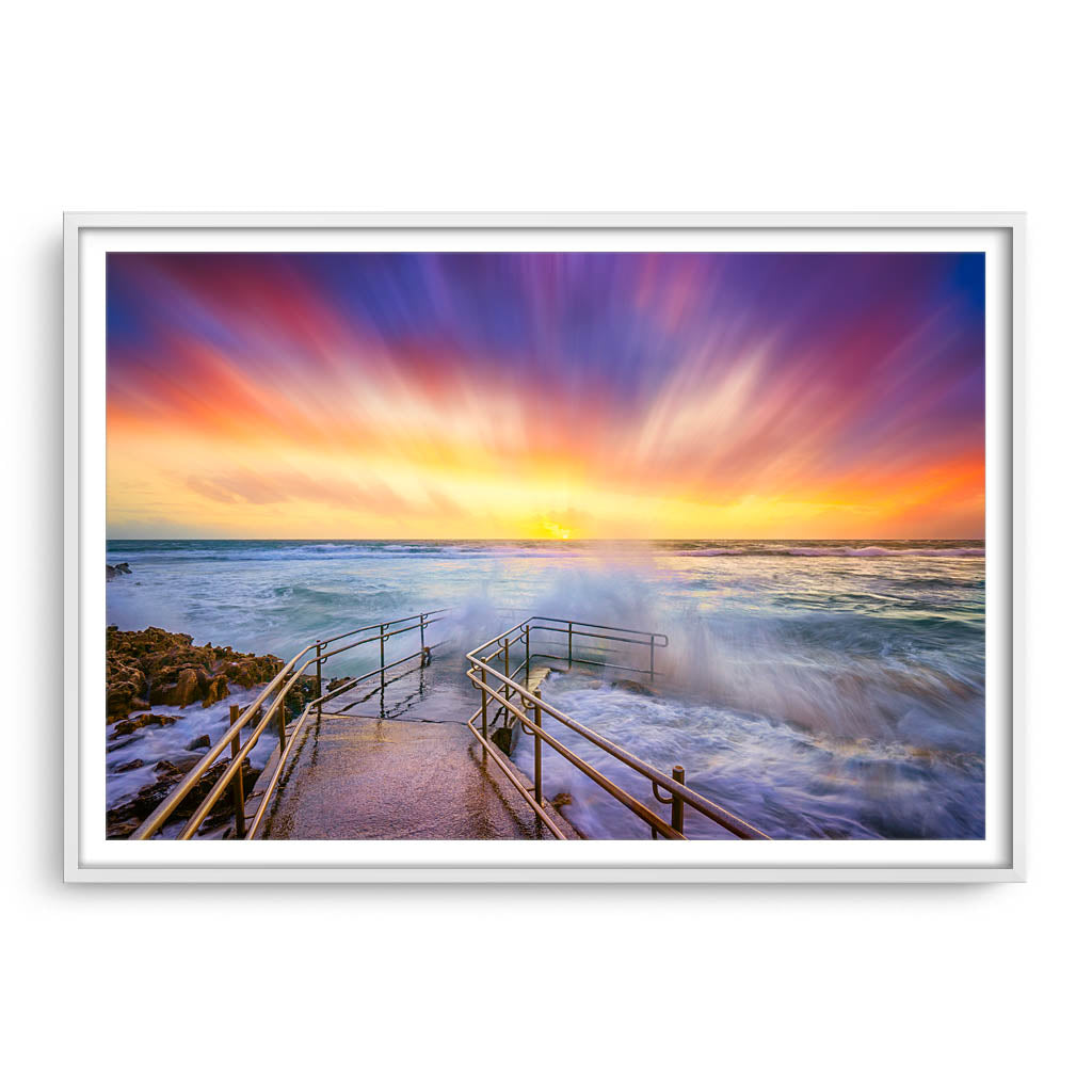 Colourful stormy sunset at Mettams Pool in Perth, Western Australia framed in white