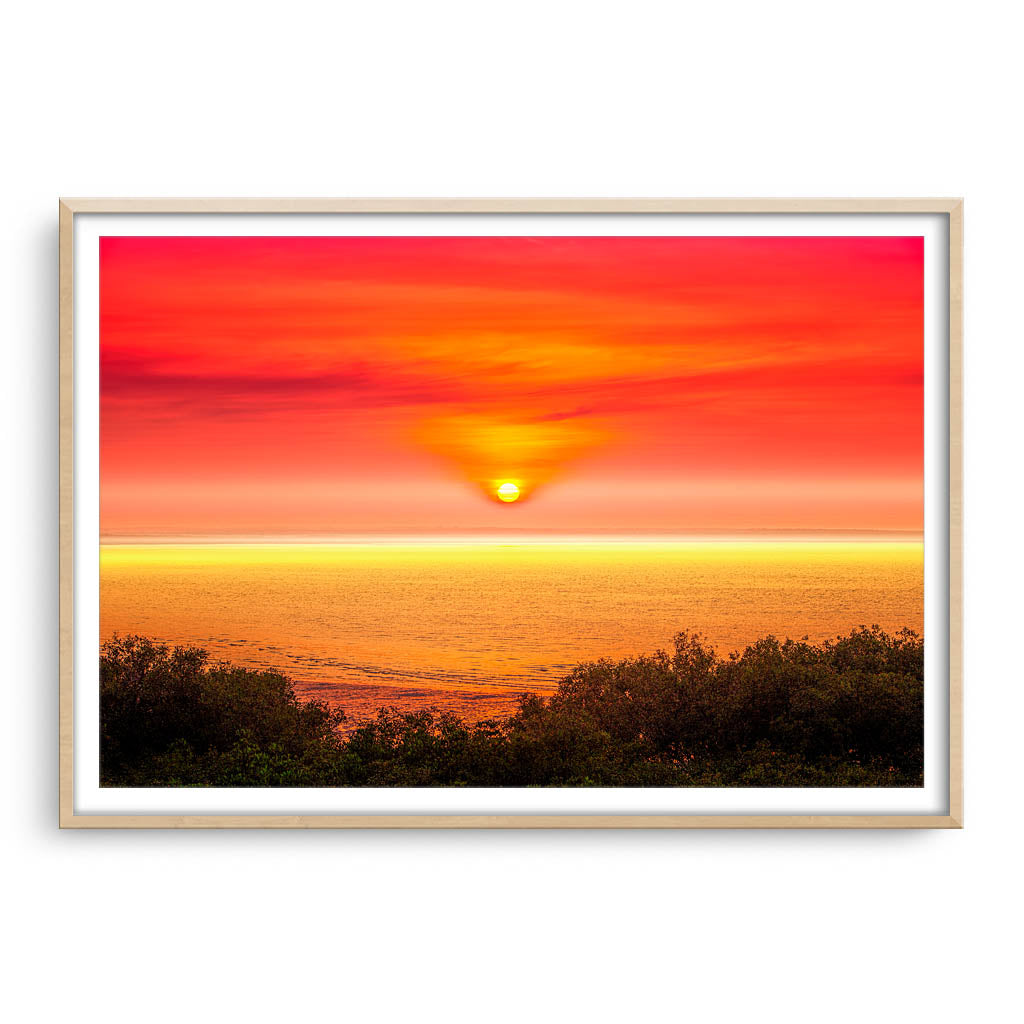 Sunrise over Broome in Western Australia framed in raw oak