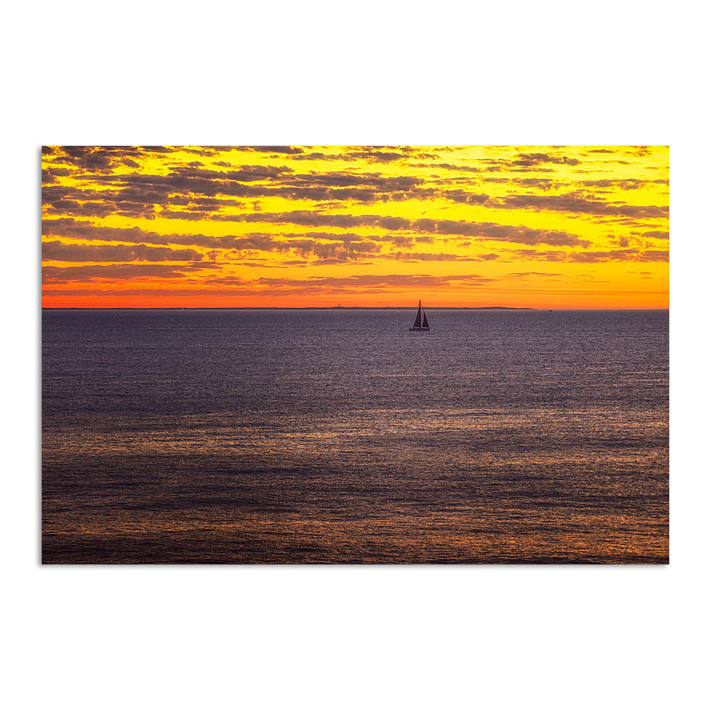 Boat sailing past rottnest island at sunset in Perth, Western Australia